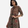 Floral Printed three-quarter sleeved tunic with shrug in crepe fabric. Round neck. A button fastening at the front with karchupi and crepe inner inside.