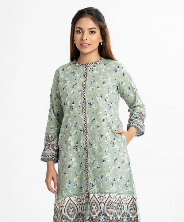 Women's floral printed A-line long tunic in cotton fabric. Stand collar and full sleeves. Lace attached at front hemline and sleeves. Inseam pockets.