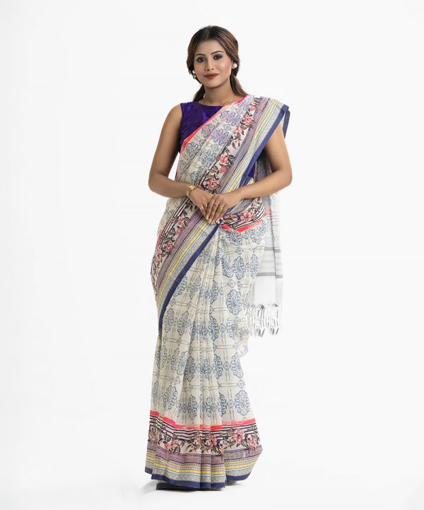 Women's all over printed saree in cotton fabric. Fringe trim at the achal.