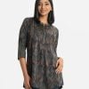 Women's printed A-line tunic in exclusive jacquard fabric. Stand collar with zipper opening at the top front. Long sleeves, two pockets.