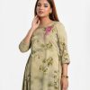 Printed A-line long tunic in textured georgette fabric. Round neck, three-quarter sleeved. Embroidery at the top front.