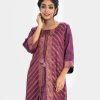 Printed A-line front slit kameez in georgette fabric. Round neck, three-quarter sleeved. Karchupi at the front.