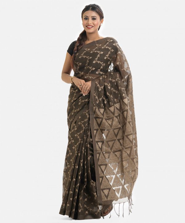 Women's traditional saree in cotton fabric. Embellished with weaving details and fringe trim at the achal.