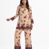 Floral printed top bottom set in zoom fabric. Classic collar, long-sleeved, button fastening top and palazzo pant.