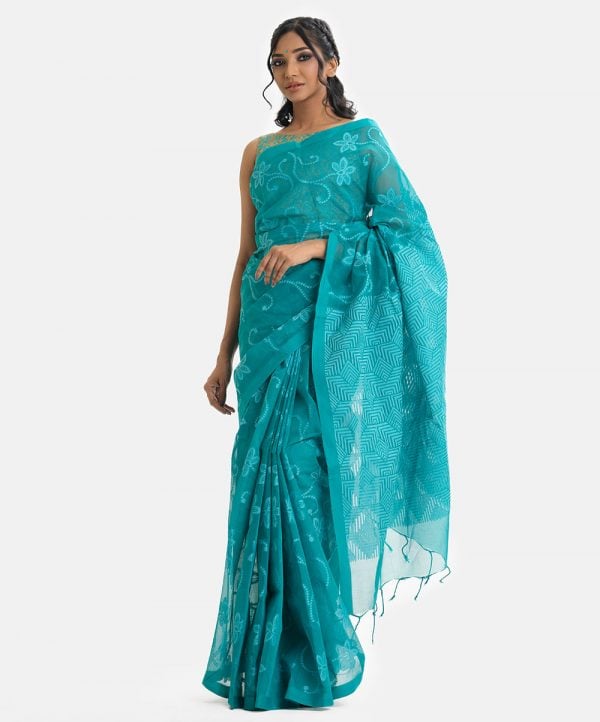 Women's traditional saree in cotton fabric. Embellished with weaving details and fringe trim at the achal.