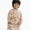Kid boys panjabi in printed cotton fabric. Mandarin collar and inseam pockets.
