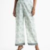 Women's all-over printed palazzo in cotton fabric. Concealed elasticated waistline.