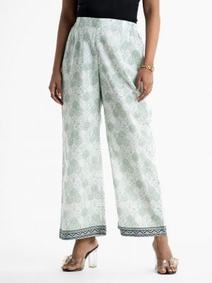 Women's all-over printed palazzo in cotton fabric. Concealed elasticated waistline.