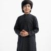 Kid boys panjabi in cotton fabric. Mandarin collar, full-sleeved. Inseam pockets and button fastening at the front.