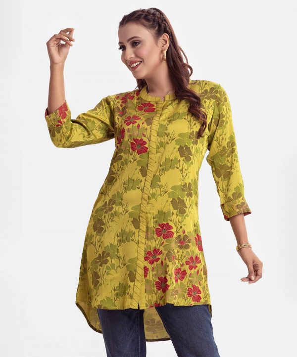 Printed A-line shirt in Crepe fabric. Stand collar, and three-quarter sleeves with roll up cuffs. High low hem and embroidery at the front.