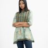 Printed A-line tunic in blended cotton fabric. Round neck with tassel tie, three-quarter sleeved and kachupi at the front.