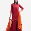 Women's printed straight salwar kameez in crepe fabric. Round neck, three-quarter sleeved and karchupi at the front. Complemented with palazzo pant and silk dupatta.