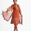 Women's printed straight salwar kameez in crepe fabric. V-neck, three-quarter sleeved. Patch attachments with karchupi at the front. Completed with crepe culotte pants and chiffon dupatta.