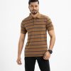 Short sleeved polo shirt in mercerised cotton knit fabric. Button opening at front with ribbed collar and cuffs.