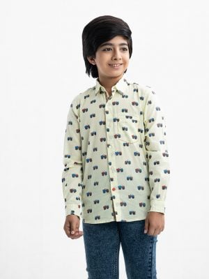 Kid boys vehicle printed long-sleeved shirt in cotton fabric. Classic collar and button fastening at the front.