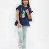 Round neck top in cotton single jersey fabric. Short ruffle sleeves. Pineapple print at top front.