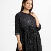 Women's shrug style long tunic in printed georgette fabric. Stand collar, three-quarter sleeves. Karchupi at front.