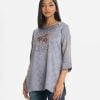 Printed A-line short tunic in crepe fabric. Long sleeves, Round neck and karchupi at the front.