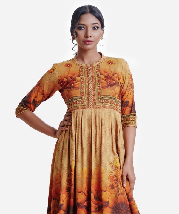 Women's A-line tunic in viscose fabric. Three-quarter sleeves, line stitching at band collar with placket. Embroidery at front.