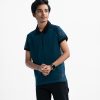 Teen boys short-sleeved polo shirt in cotton pique fabric and rib collar.