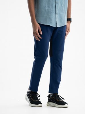 Teen boy's track pants in french terry fabric. Elasticated waistline with adjustable drawstring.Zipper fly at side and back pockets. Mesh fabric attached for comfort and flexibility.