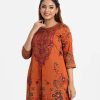 Printed A-line front slit kameez in crepe fabric. Round neck, three-quarter sleeved. Karchupi at the front.