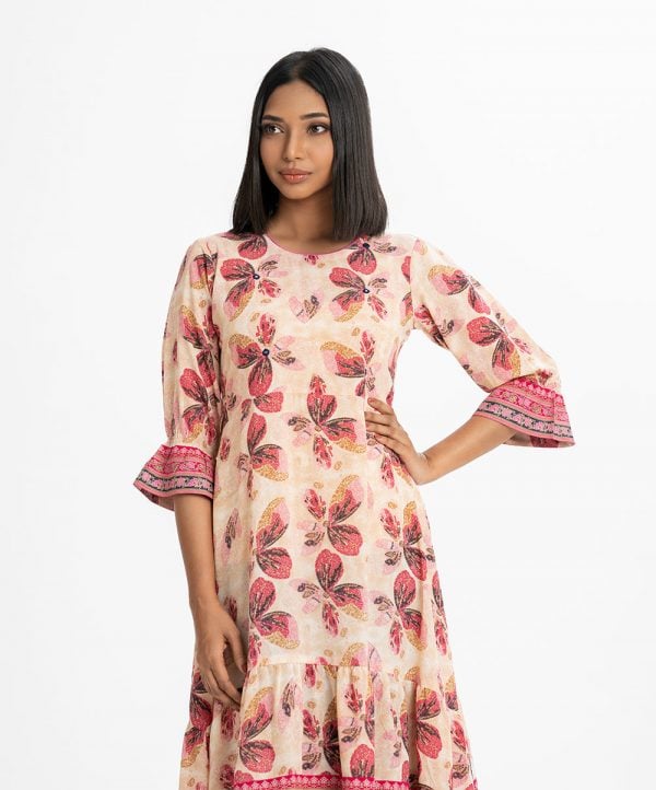 Women's floral printed A-line long tunic in Georgette fabric. Stand collar and three-quarter sleeves with patch & elasticated cuff.