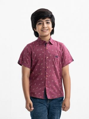 Kid boys printed short-sleeved casual shirt in printed cotton fabric. Classic collar, button fastening at the front.