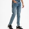 Teen boys slim-fitted denim pant. Zipped side pockets with two patch pockets on the back.