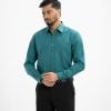 Men's printed long-sleeved formal shirt in cotton blended fabric. Classic collar, button fastening at the front and adjustable buttons at the cuffs.