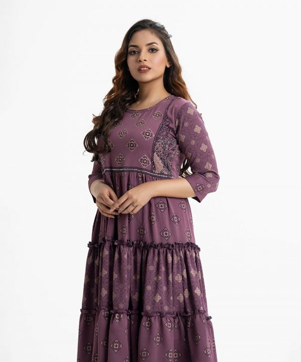 Printed tiered style long tunic in georgette fabric. Round neck, three-quarter sleeved. Gathered at the waistline and karchupi at the front.