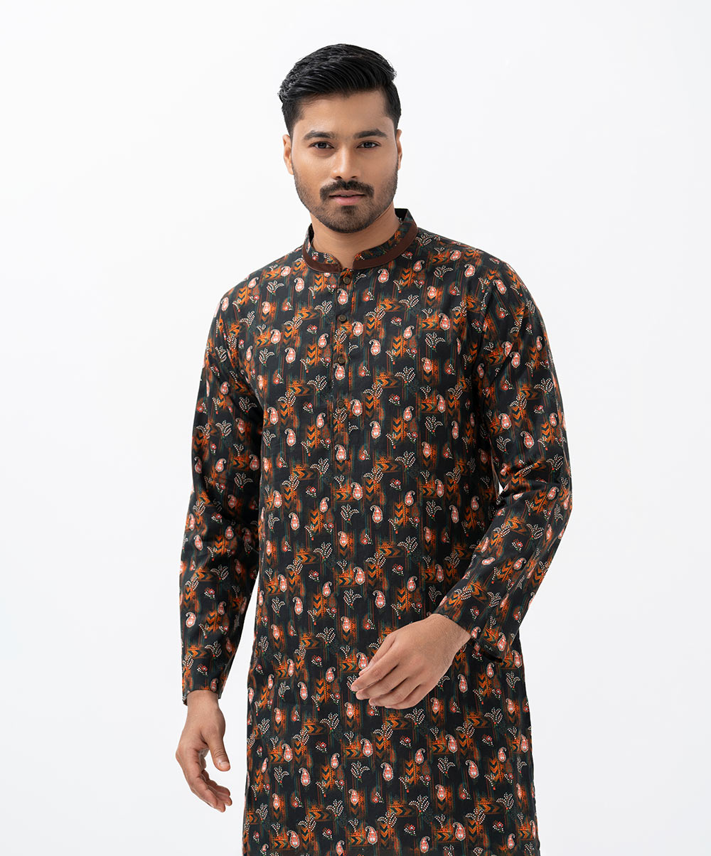 Men's semi-fitted panjabi in cotton fabric. Mandarin collar, inseam pockets and long sleeves. Men's semi-fitted panjabi in cotton fabric. Mandarin collar, inseam pockets and long sleeves.