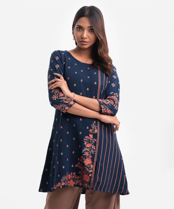 Round neck stretchable georgette tunic with three-quarter sleeves and embroidery.