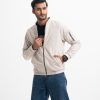 Men's bomber jacket in cotton-blend fabric. Stand-up collar, zip at front & diagonal welt side pockets. Quilted lining.