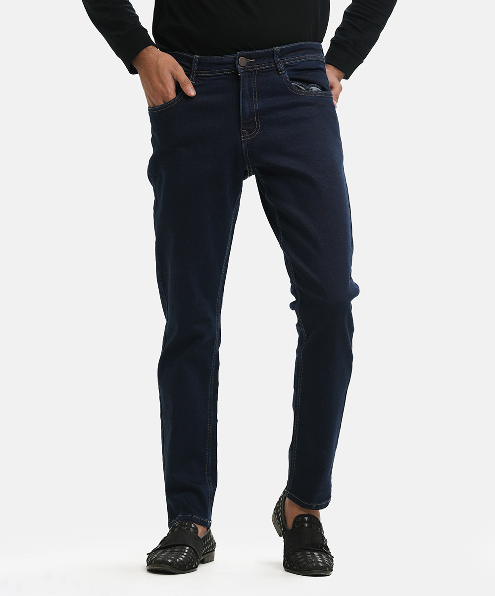 Men's slim fitted jeans pants in cotton blended denim fabric. Five pockets, button fastening on the front and zipper fly. Navy Blue Denim Jeans Pants