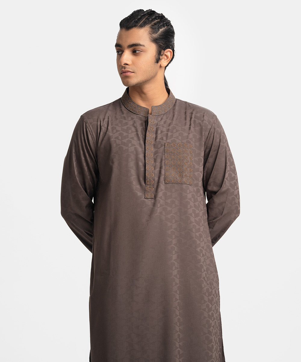 Ethnic panjabi in cotton jacquard fabric. Embroidery on the hidden button placket, chest pocket and collar. Inseam side pockets. Dark Olive Jacquard Semi-Fitted Panjabi