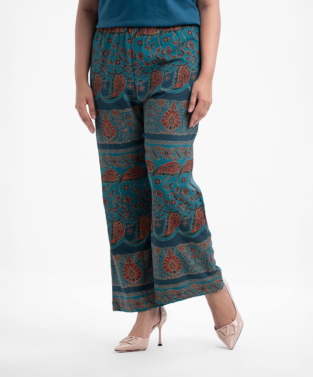 Women's printed palazzo in stretchable georgette fabric. Concealed elasticated waistline. Teal Stretchable Georgette Printed Palazzo