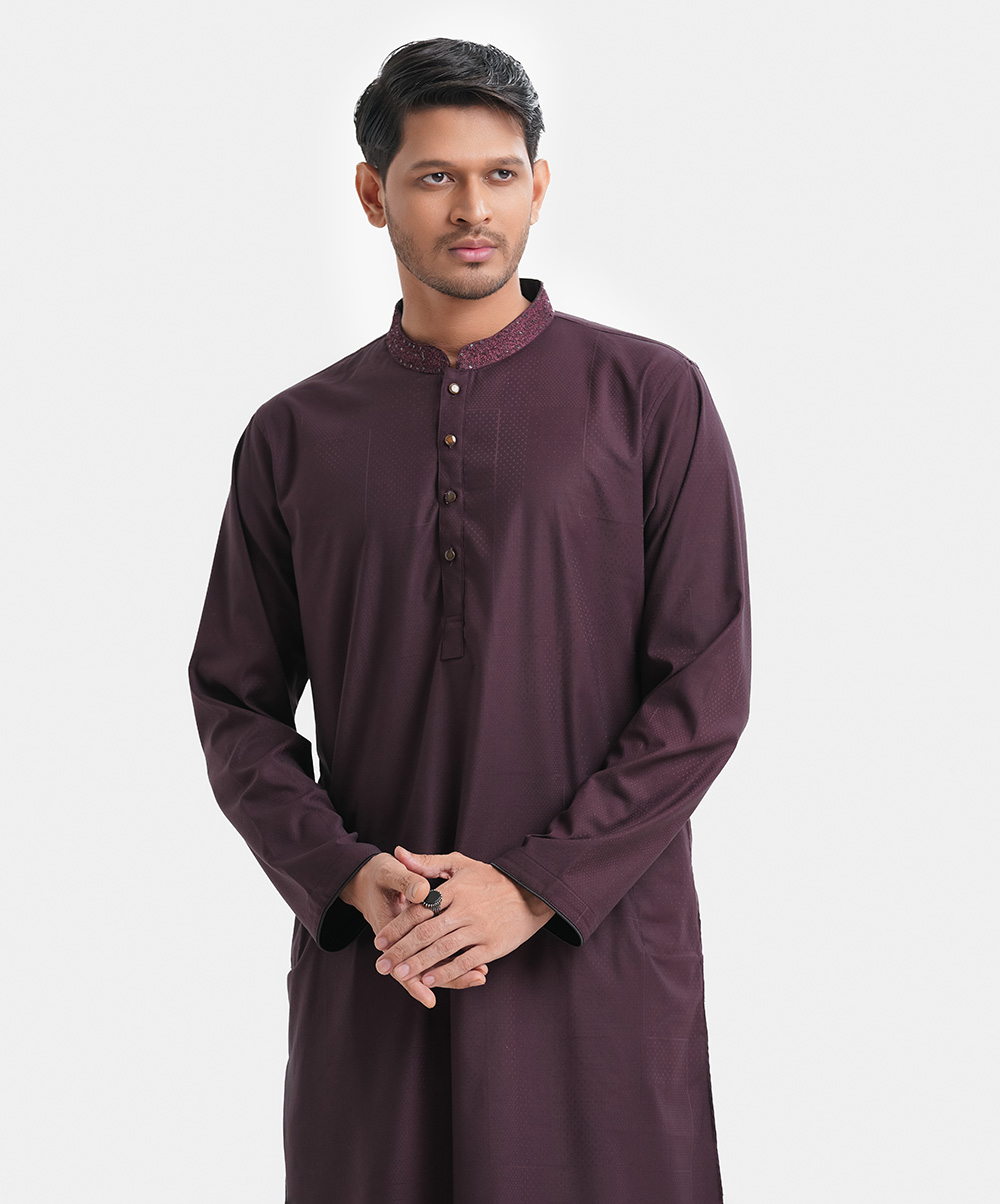 Men's semi fitted panjabi in jacquard fabric. Karchupi works at mandarin collar. Buttons placket & full sleeves. Inseam pockets. Burgundy Jacquard Semi Fit Panjabi