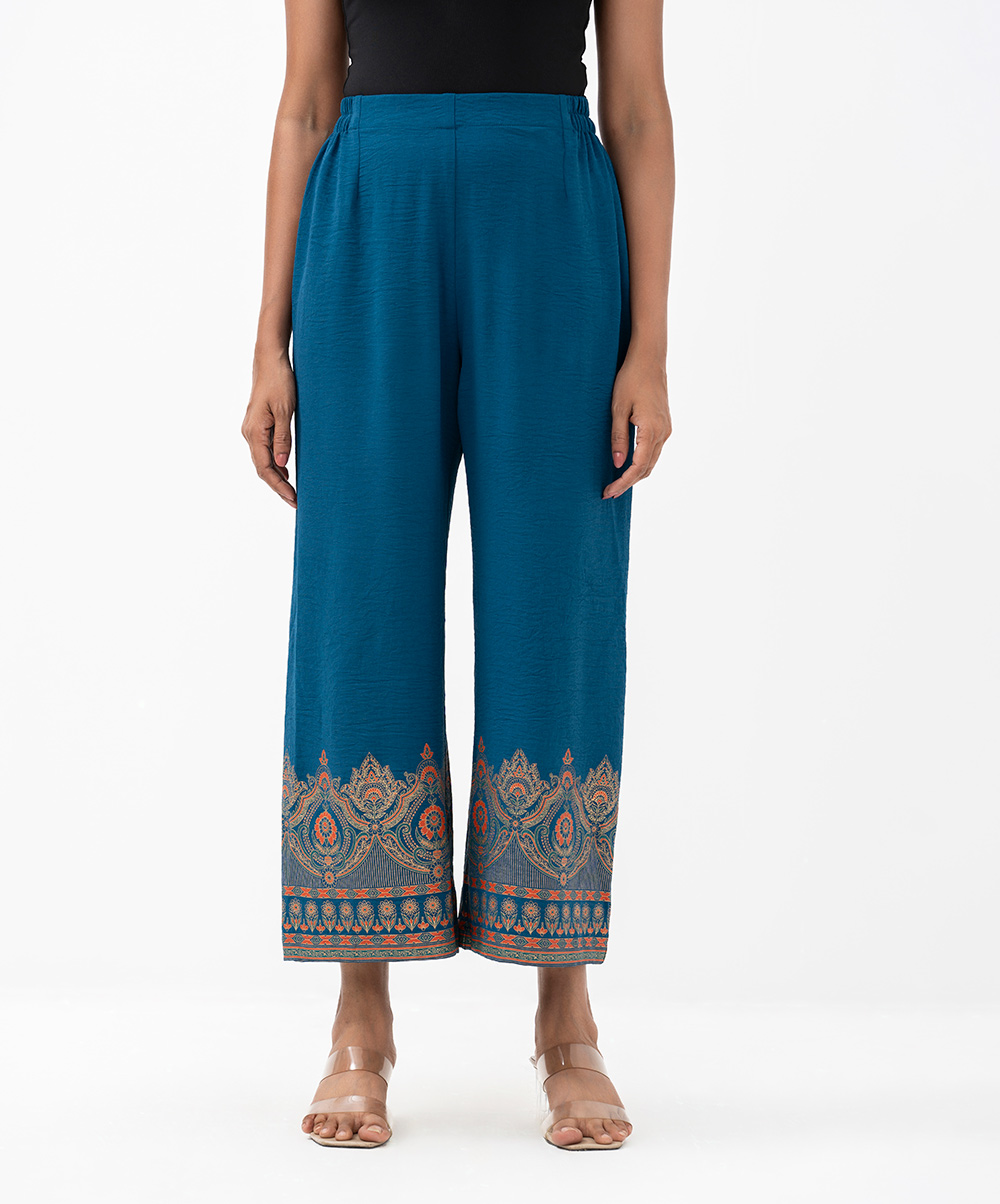 Women's palazzo in stretchable georgette fabric. Concealed elasticated waistline. Print details on leg lines. Teal Stretchable Georgette Palazzo