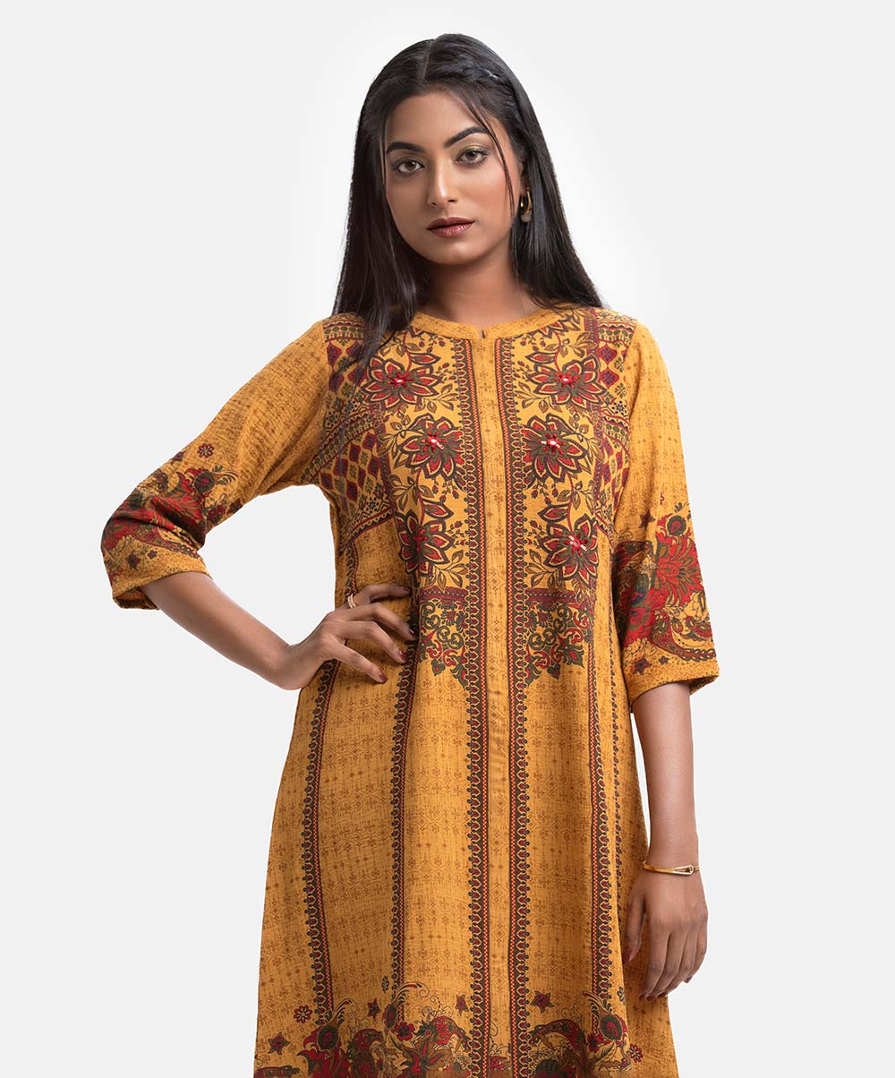 Women's printed A-line tunic in stretchable georgette fabric. Stand collar, three-quarter sleeves. Karchupi at front. Mustard Yellow Stretchable Georgette A-line Tunic