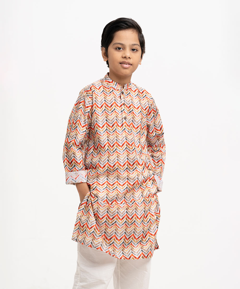 Kid boy's panjabi in chevron printed cotton fabric. Mandarin collar, buttons placket & full sleeves. Inseam pockets. Multi-color Cotton Panjabi