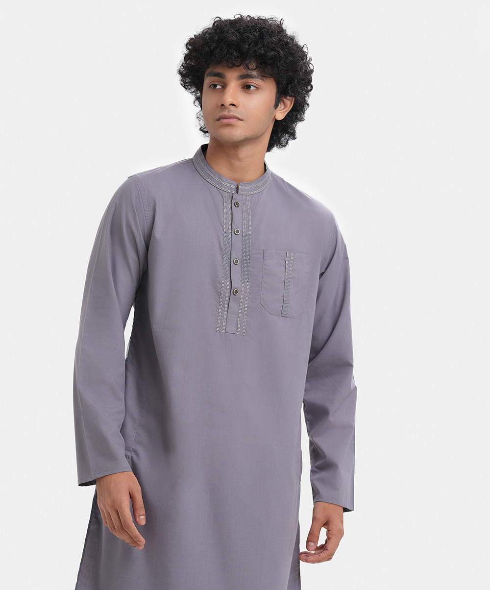 Men's single color fitted panjabi in cotton blended fabric. Embroidery at mandarin collar, buttons placket side and front pocket. Full sleeves & inseam side pockets. Gray Embroidered Fitted Panjabi