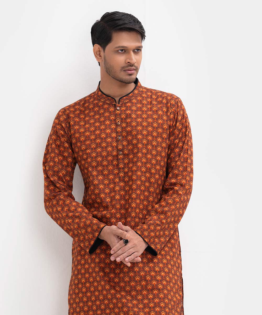 Men's semi fitted panjabi in printed cotton fabric. Mandarin collar, buttons placket & full sleeves. Inseam pockets. Orange Cotton Semi Fit Panjabi