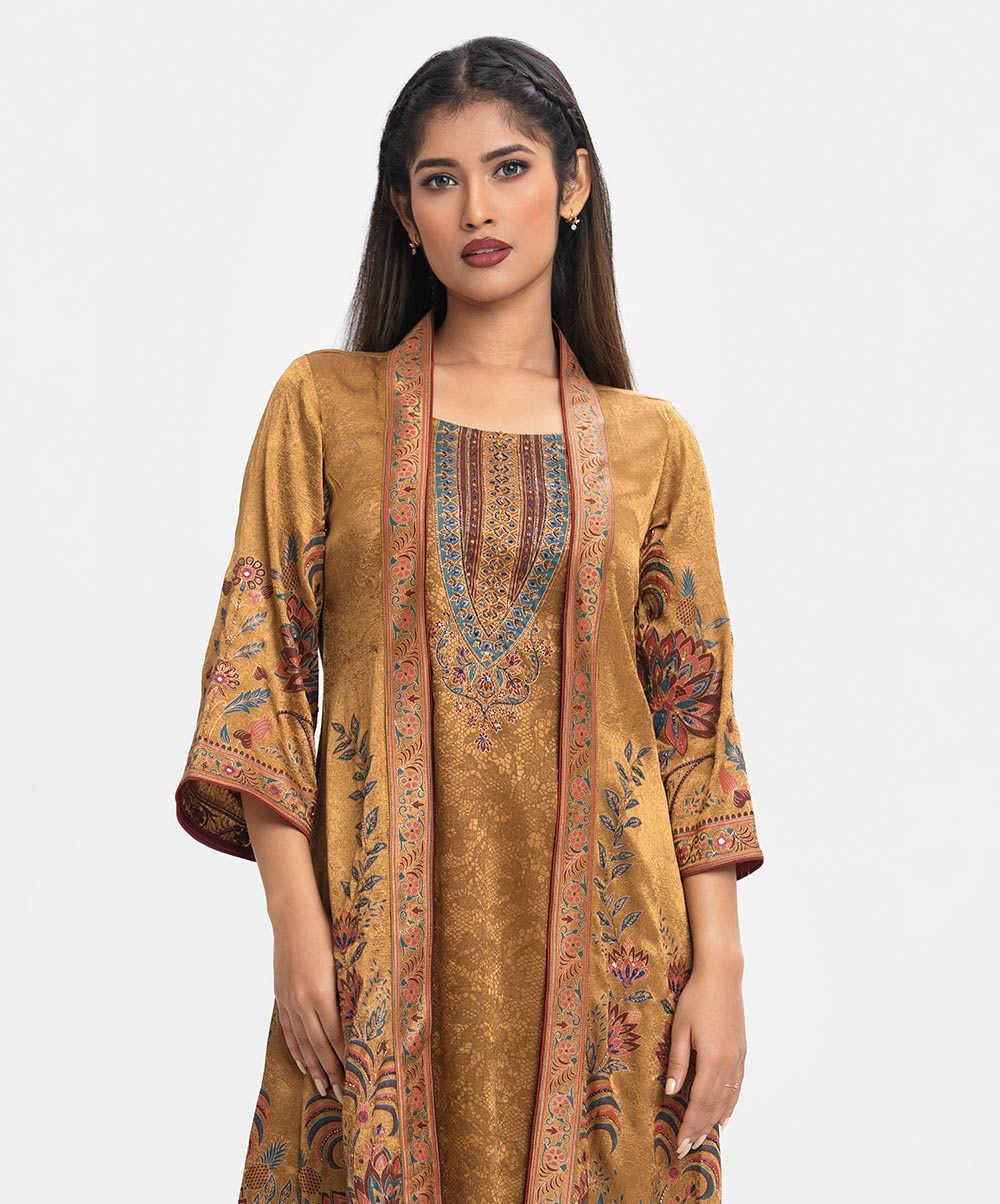 Round neck tunic with shrug in georgette-blend fabric with a sheen. Three-quarter sleeves with karchupi at the front. Green Georgette Tunic with Shrug