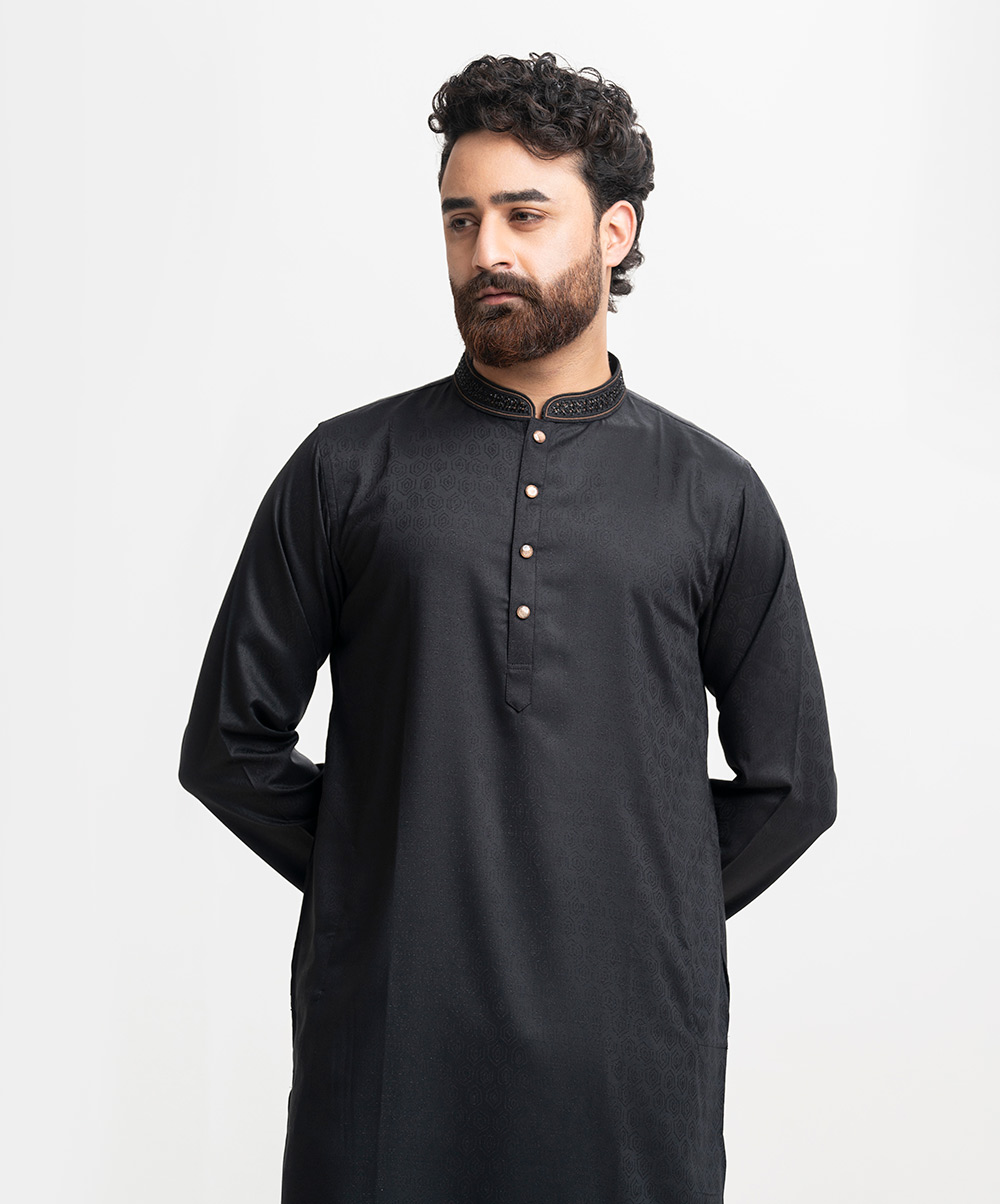 Exclusive fitted panjabi in premium jacquard fabric. Karchupi on the collar. Inseam side pockets. Black Jacquard Fitted Panjabi