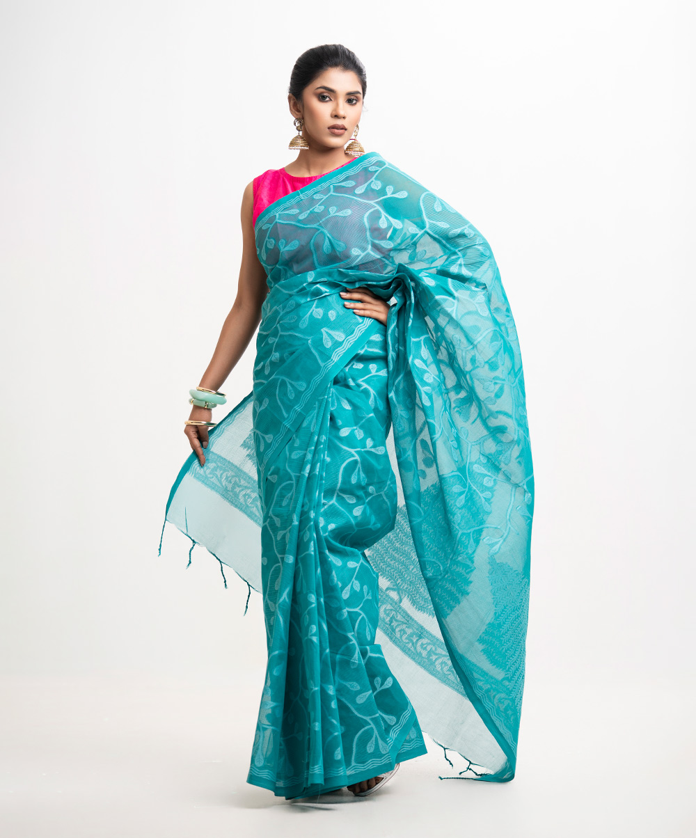 All-over weaving details saree in cotton fabric. Fringe trim at the Aanchal. Turquoise Green Cotton Saree