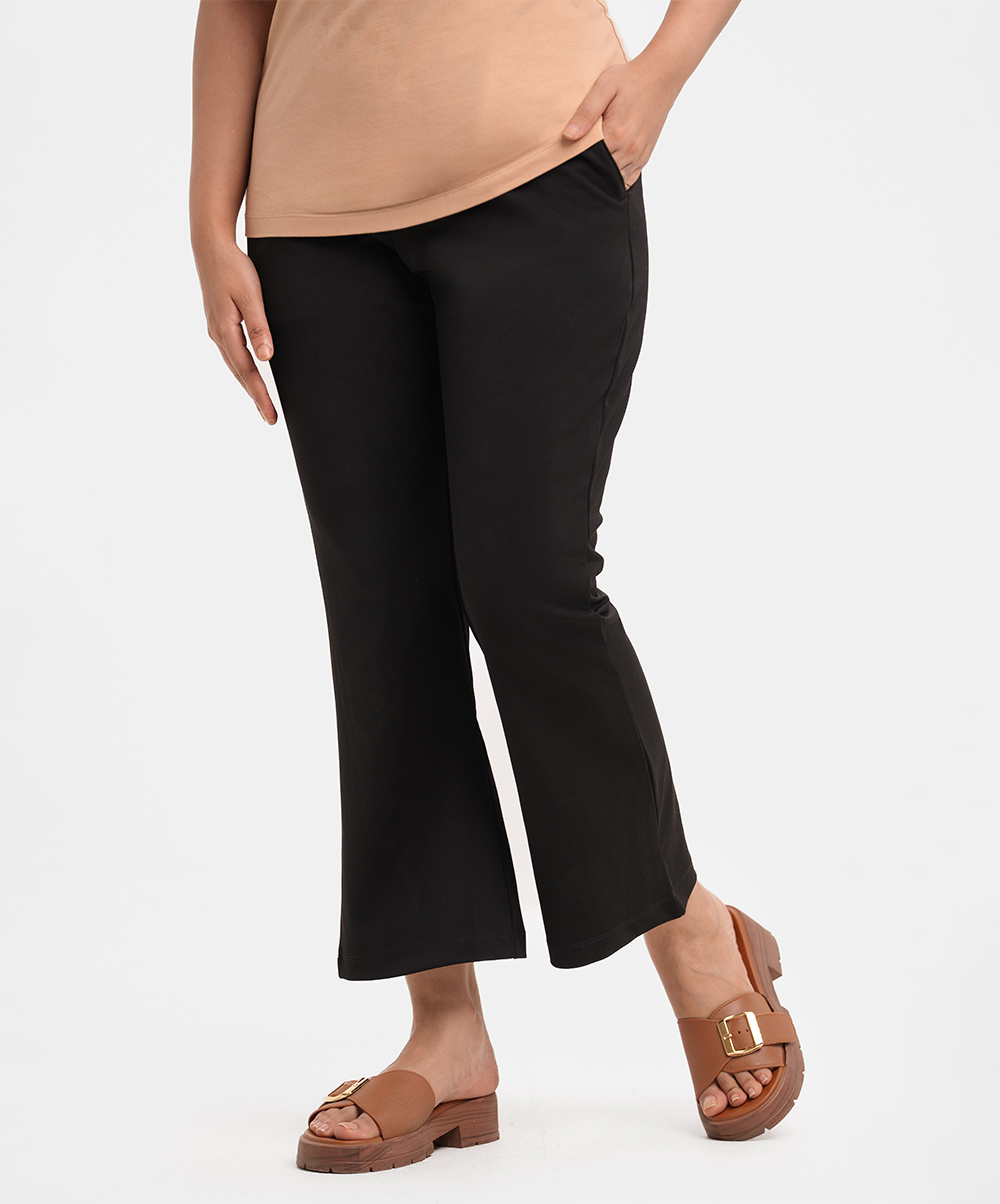 Women's formal pants in stretched Interlock knit fabric. Conseal elastic waistline and two side pockets. Black Interlock Knit Formal Pant