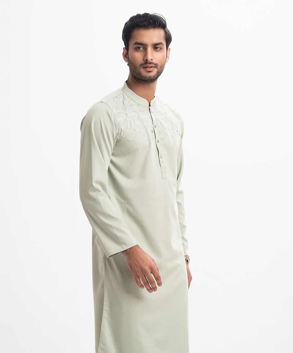 Fitted cotton jacquard panjabi in cotton jacquard fabric. Embroidery on the collar and placket. Inseam side pockets. Green Jacquard Fitted Panjabi