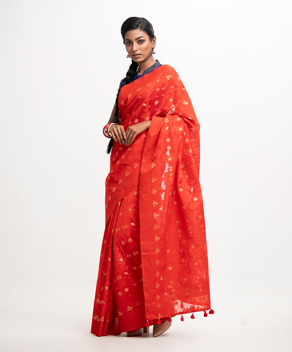 All-over weaving details saree in half-silk fabric. Zari threads & tassels at the Aanchal. Red Half-silk Saree