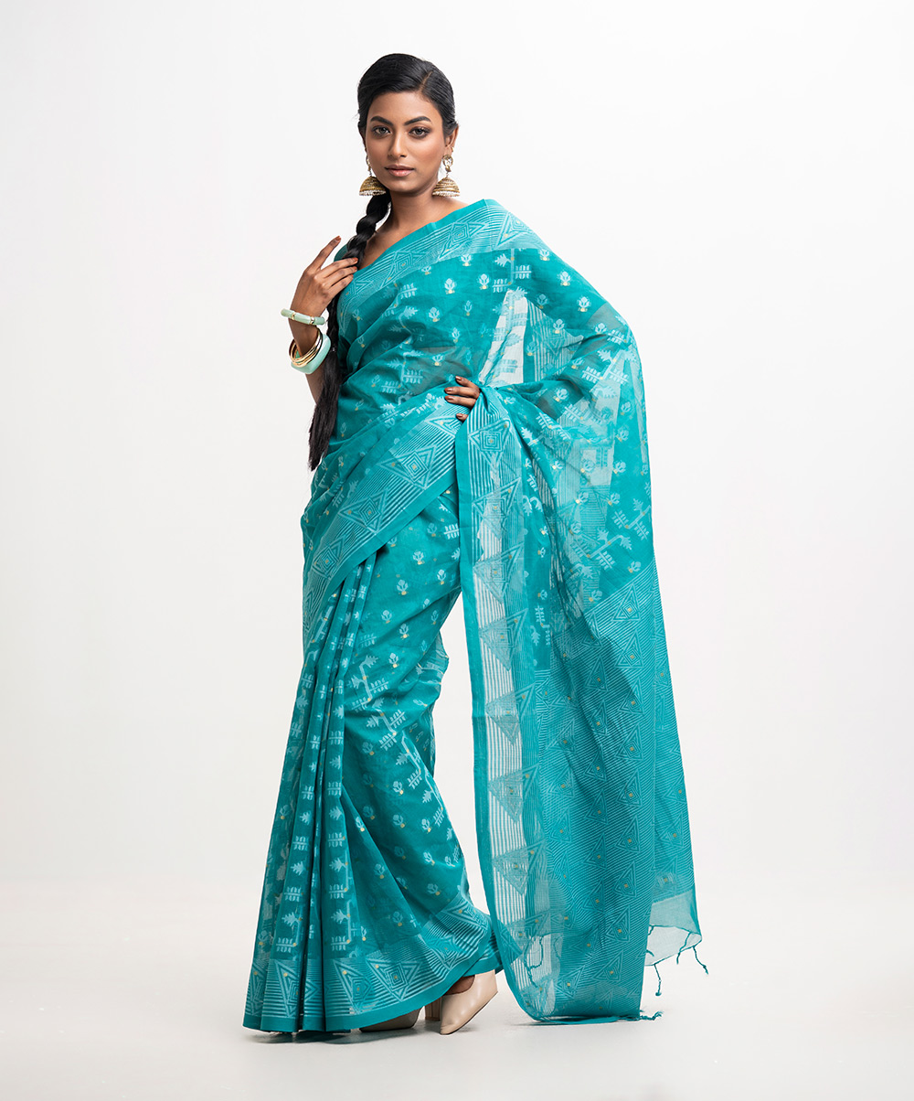 All-over weaving details saree in cotton fabric. Fringe trim at the Aanchal. Turquoise Green Cotton Saree
